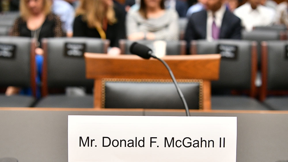 A seat and name card are set for former White House lawyer Don McGhan