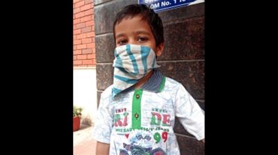 Utsav's parents say they are unable to afford quality masks for him [Nadim Asrar/Al Jazeera]