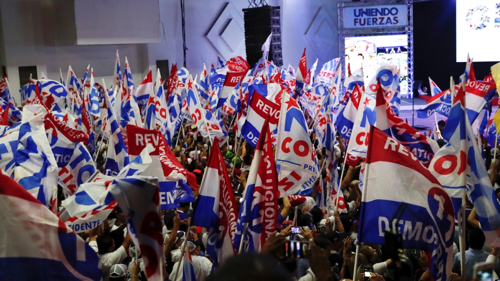 Supporters of president-elect Cortizo wave flags in Panama City [Carlos Jasso/Reuters]