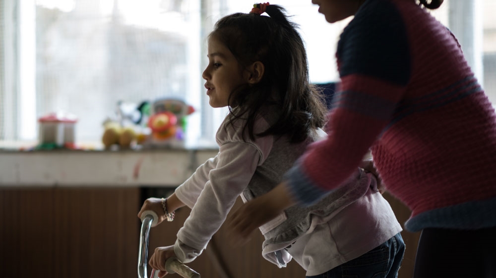Refugee children staying at Notara find temporary respite from their exhausting journey [Sorin Furcoi/AL Jazeera]