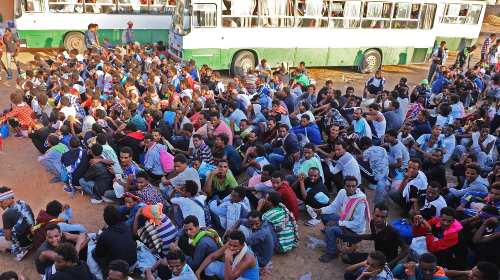 Migrants are seen after they were relocated from government-run detention centres, after getting trapped by clashes between rival groups in Tripoli, Libya