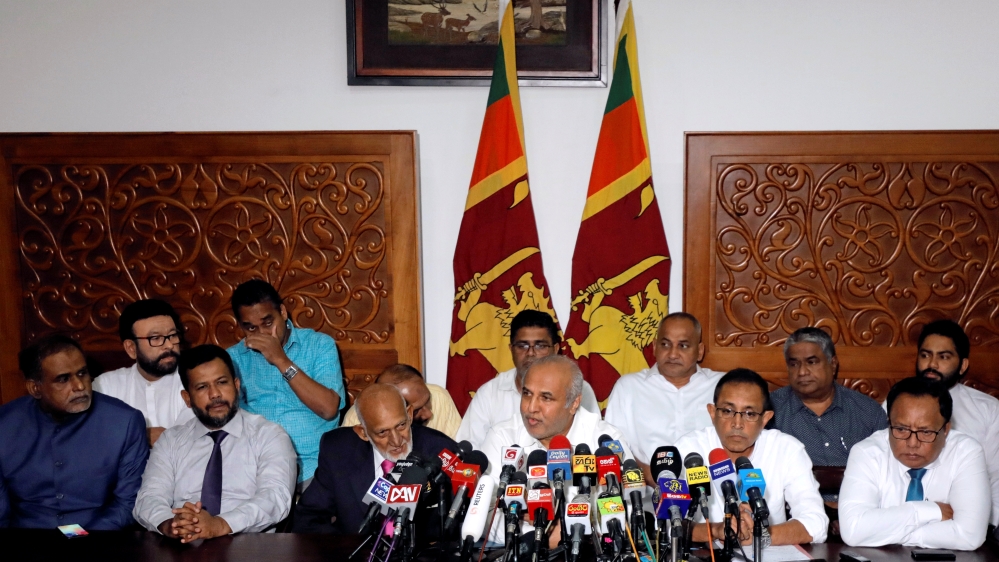 Hakeem, former minister of city planning, water supply and higher education, speaks to media with other muslim ministers after they resigned from their portfolios, in Colombo,