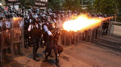 Police officers fire a tear gas during a demonstration against a proposed extradition bill in Hong Kong, China June 12, 2019. REUTERS/Athit Perawongmetha TPX IMAGES OF THE DAY