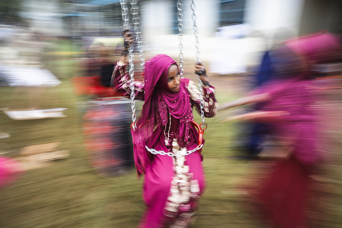 A young Muslim girl enjoys a swing ride at Eastleigh High School in Nairobi, Kenya, 04 June 2019. Muslims around the world are celebrating Eid al-Fitr, the three day festival marking the end of the Mu