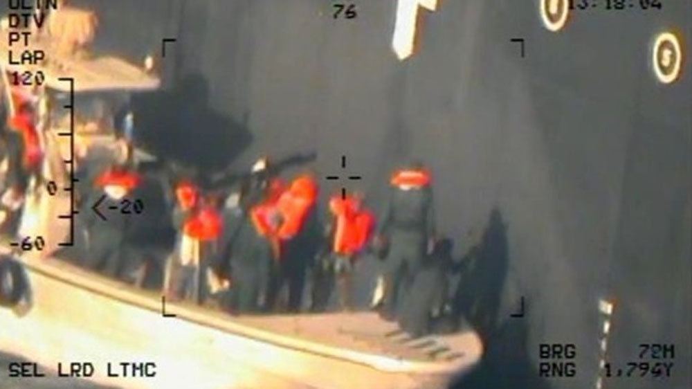 The Pentagon says the image shows Iran’s Revolutionary Guard Corps Navy removing an unexploded mine from the Kokuka Courageous on June 13