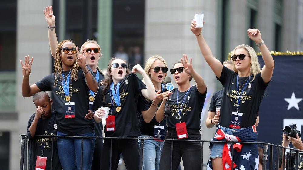 Members of the United States women's national team celebrate on a float during the ticker-tape parade for the United States women's national soccer team down the canyon of heroes in New York City. Ma