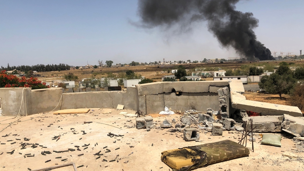 Smoke rises during a fight between members of the Libyan internationally recognised government forces and Eastern forces, in southern Tripoli, Libya June 22, 2019. REUTERS/Yosri al-Jamal