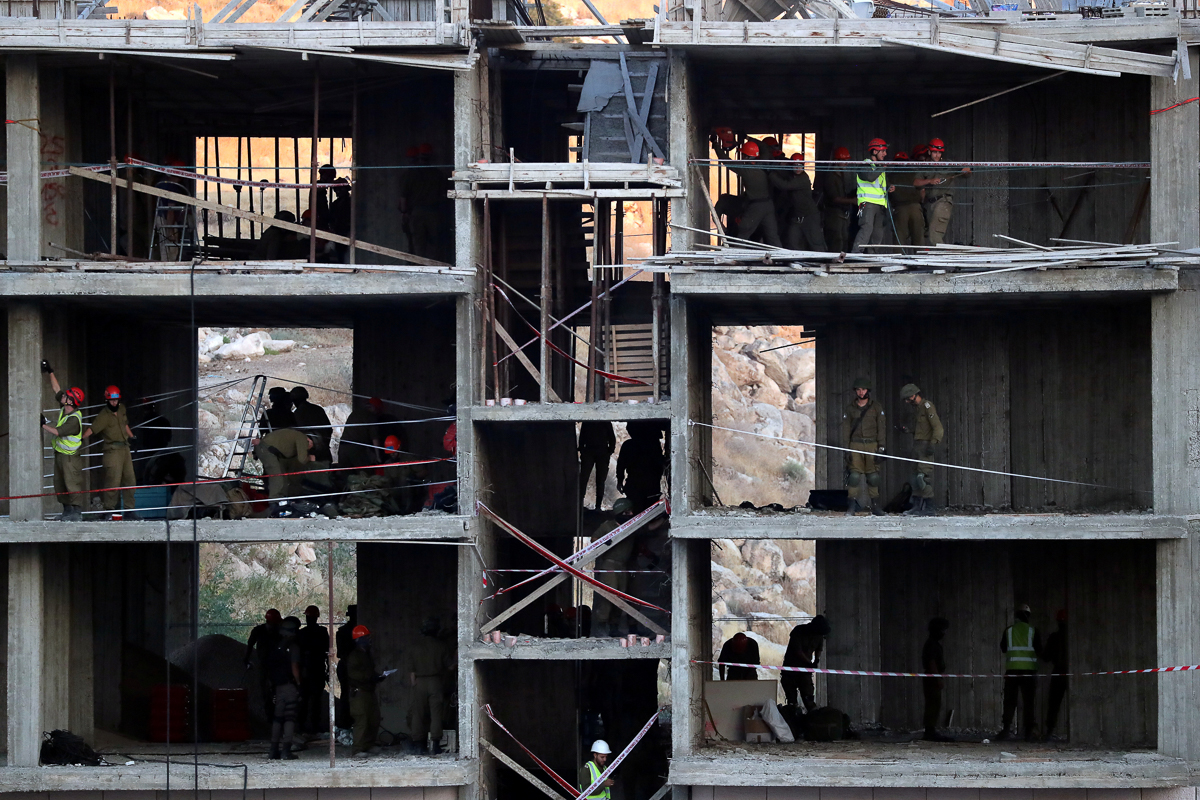 Israeli forces began preparations to demolish homes near a military barrier on the outskirts of Jerusalem July 22, 2019. REUTERS/Ammar Awad