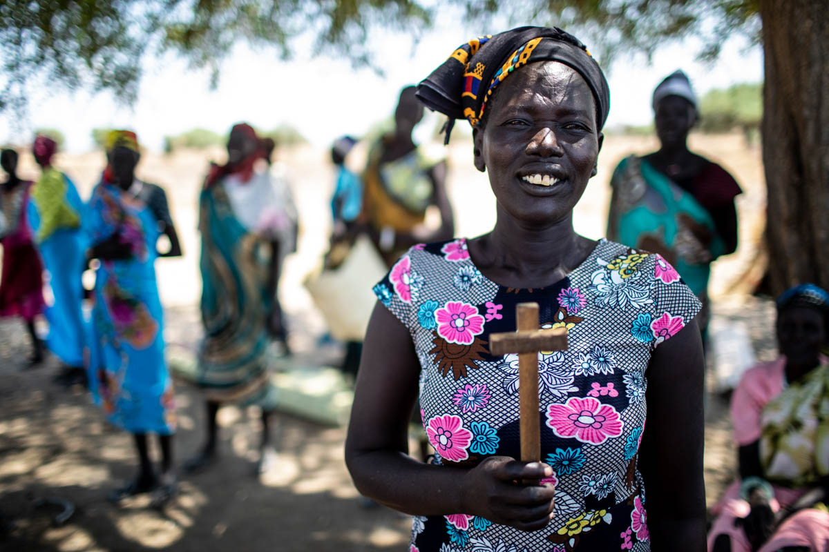 Villagers prepare to head home after a morning of working to rehabilitate a dry season pond, on April 5, 2019. “This project is helping us a lot with the development of our village and creating assets