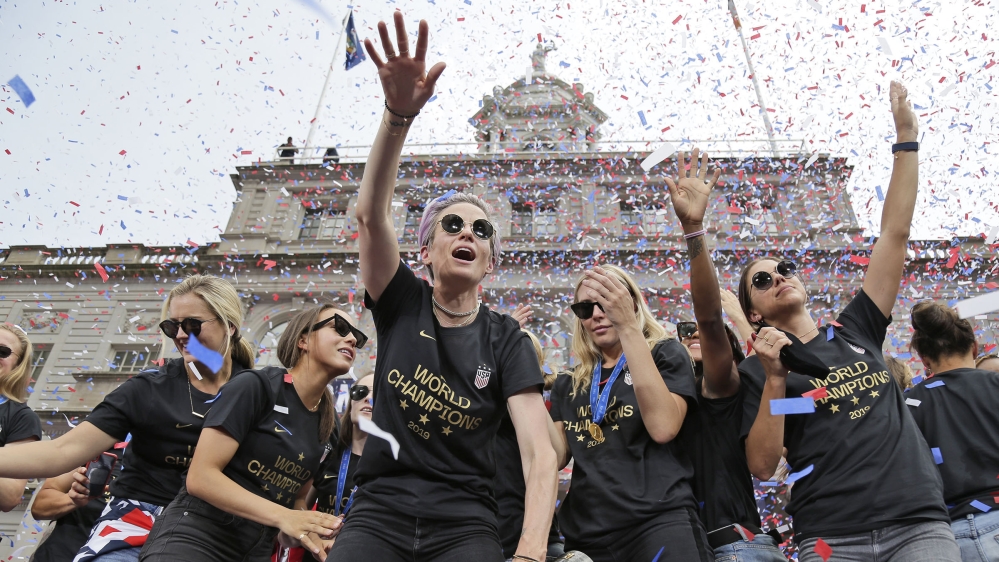 Megan Rapinoe, center, and Alex Morgan, right, celebrates with U.S. women''''s soccer teammates at City Hall after a ticker tape parade, Wednesday, July 10, 2019, in New York. The U.S. national team b