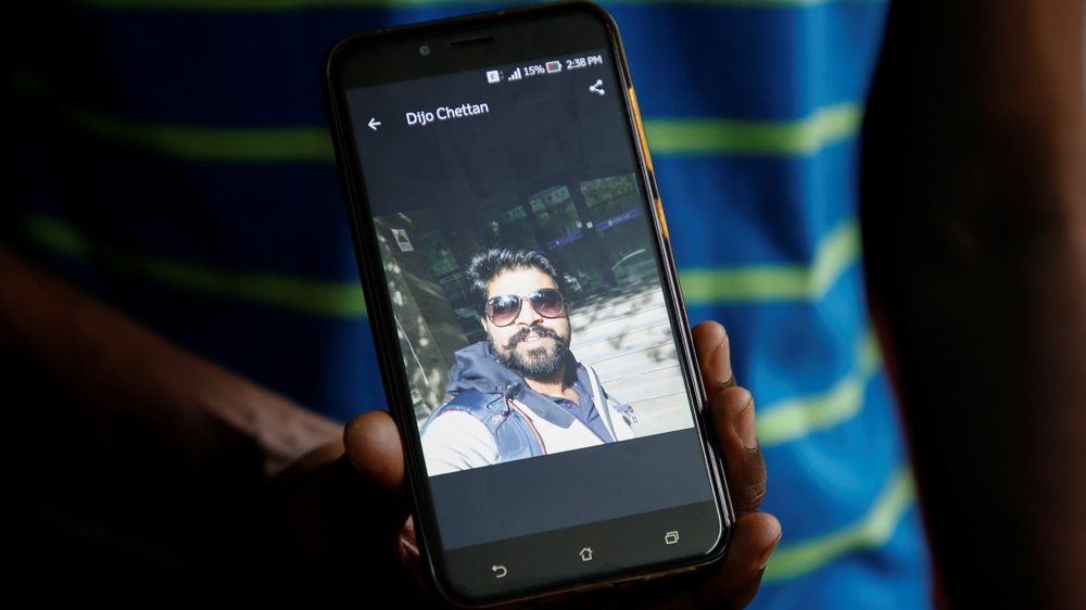 A relative in Kochi, India, shows photographs of Dijo Pappachan, one of the Stena Impero crew members