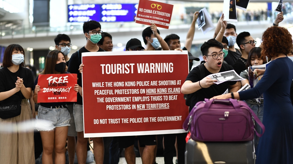 Some protesters handed flyers out to visitors as they arrived at the airport