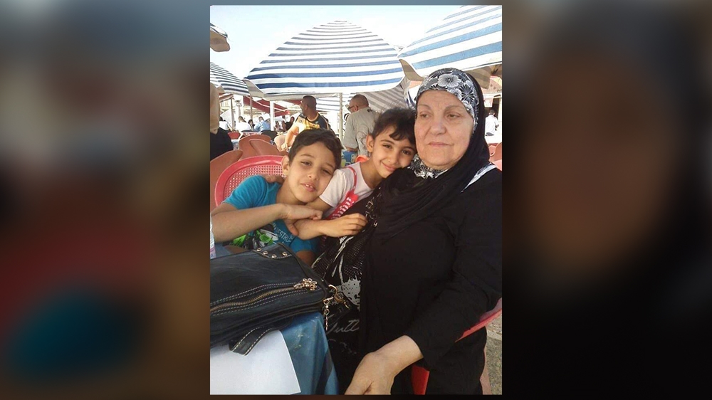 Zineb Redouane with her grandchildren [Courtesy of Milfet Redouane]