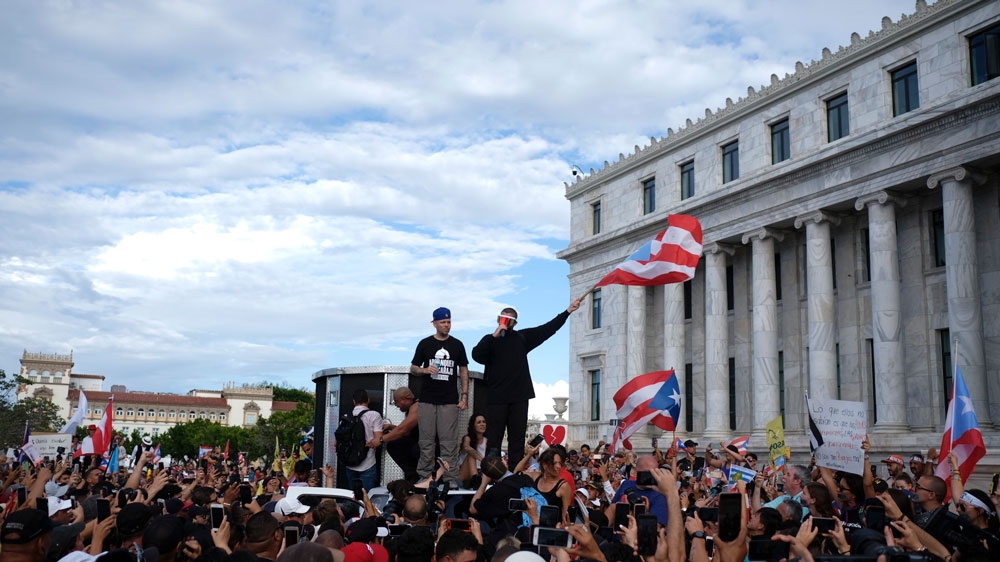 Puerto Rican rapper Rene Juan Perez warmed up the crowd in front of the Puerto Rican Capitol, before the protest march kicked off