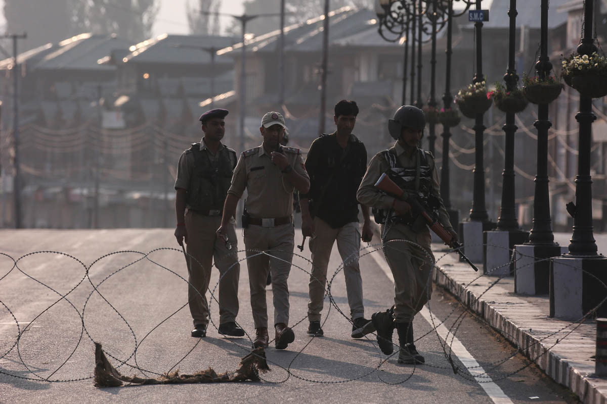 Indian security personnel patrol on deserted road during restrictions in Srinagar, August 5, 2019. REUTERS/Danish Ismail