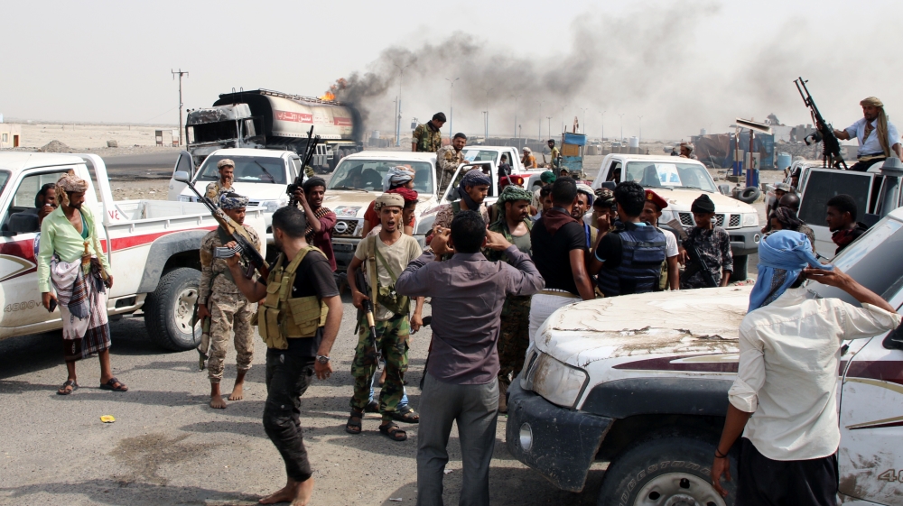 Southern separatist fighters gather during clashes with government forces in Aden