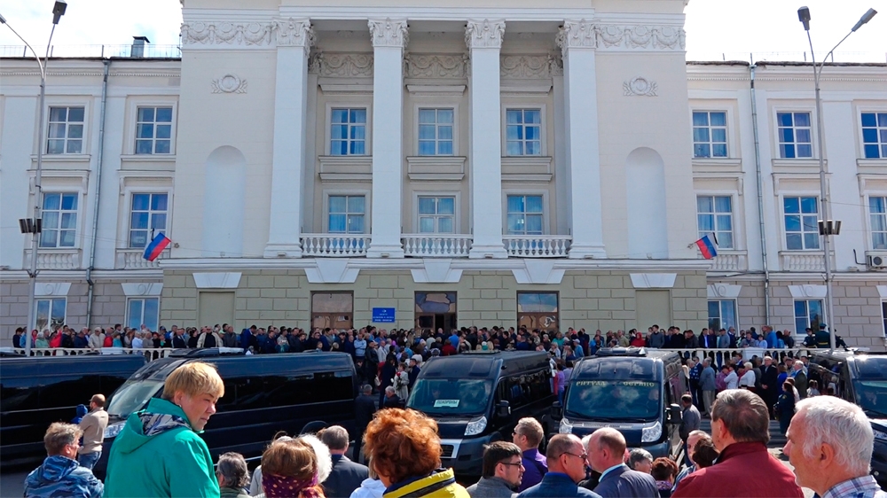 In this grab taken from a footage provided by the Russian State Atomic Energy Corporation ROSATOM press service, people gather for the funerals of five Russian nuclear engineers killed