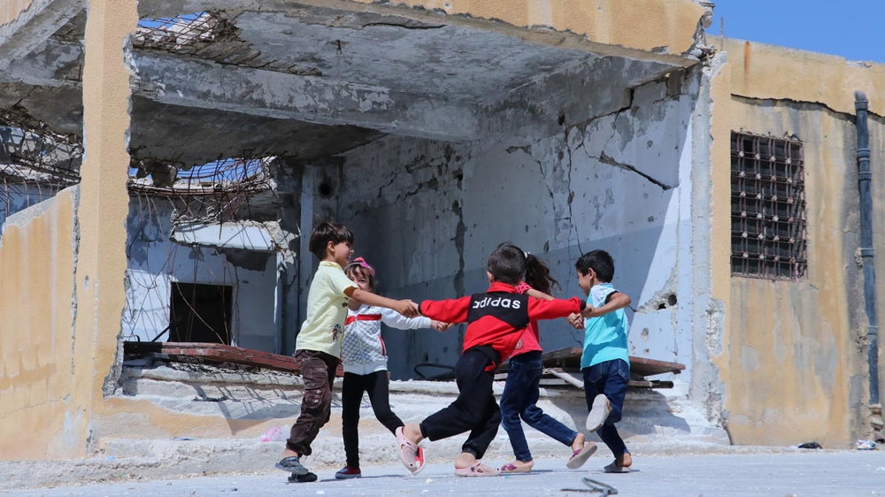 Children playing outside their school, Idlib Syria