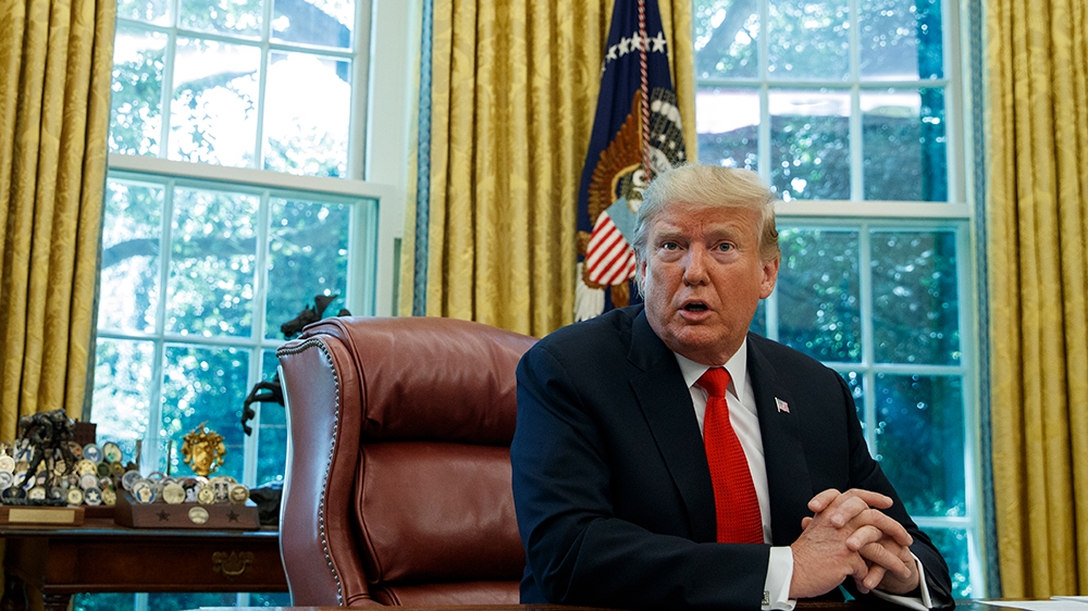 President Donald Trump talks with reporters after receiving a briefing on Hurricane Dorian in the Oval Office of the White House, Wednesday, Sept. 4, 2019, in Washington. (AP Photo/Evan Vucci)