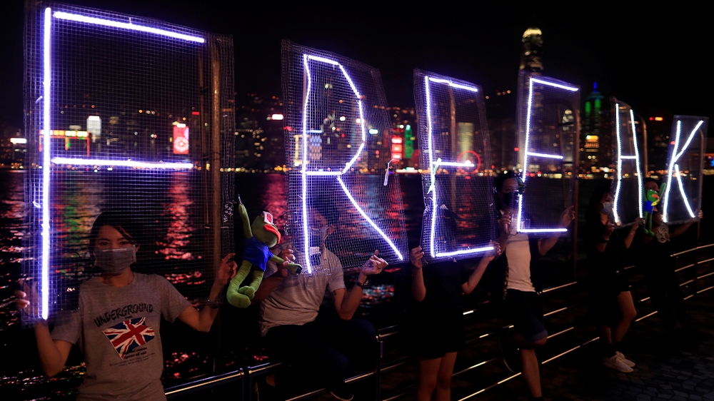 Anti-government protesters in a human chain in the harbour area in Hong Kong on the eve of Communist China’s 70th anniversary