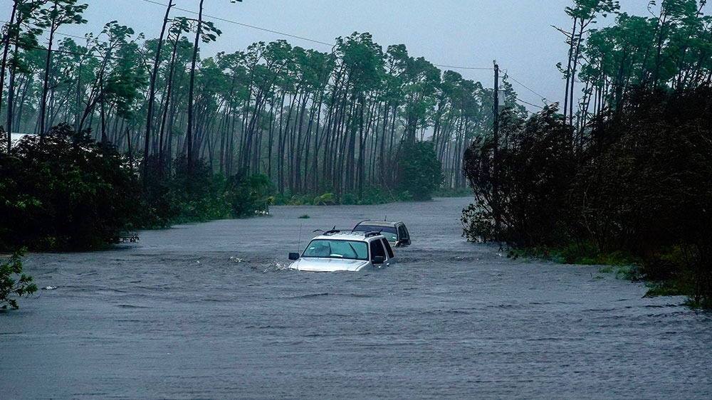 Cars sit submerged in water from Hurricane Dorian in Freeport, Bahamas
