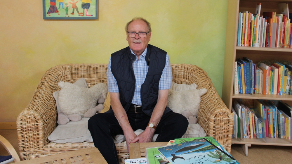 Karl Heinz Lorke, a volunteer, says he appreciates children’s unapologetic honesty
