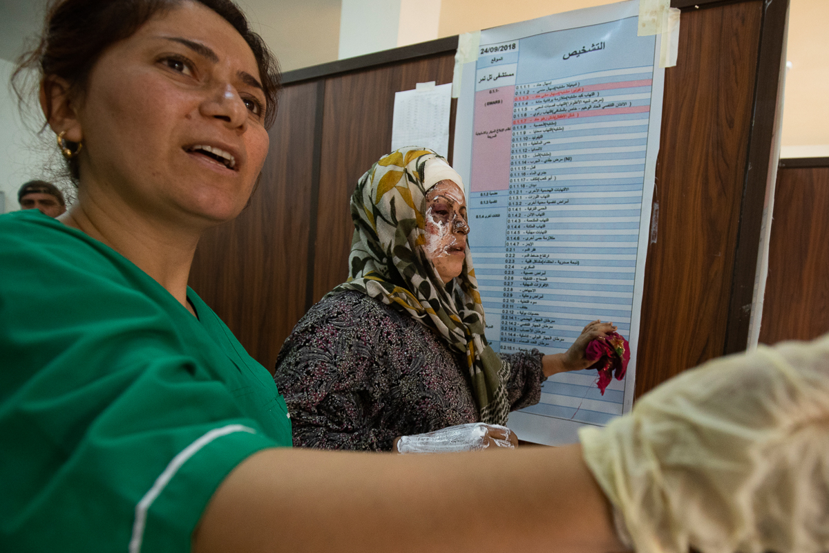 Syrian patient Fatima al-Issa who was hit by shrapnel during Turkish bombardment of Ras al-Ain, receives treatment at a hospital in the town of Tal Tamr in the countryside of Syria''s northeastern Hasa
