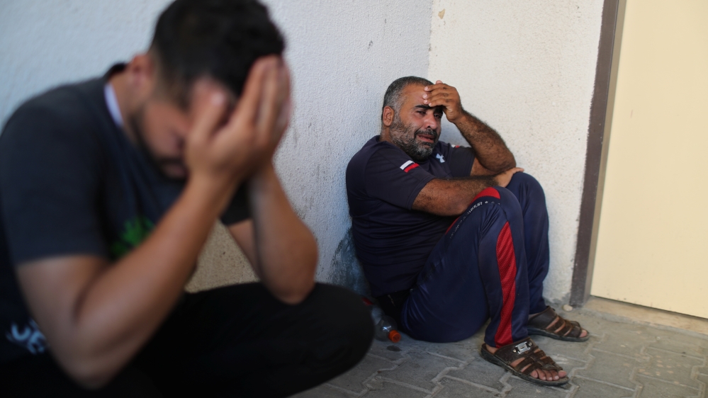 Relatives of a Palestinian who was killed at the Israeli-Gaza border fence, react at the hospital in the northern Gaza Strip