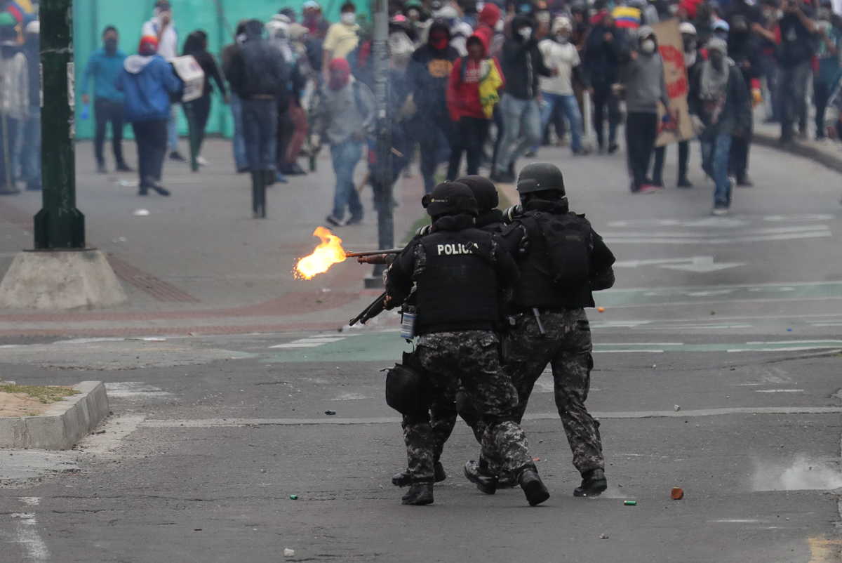 Police members face a group of protesters during a new day of protests with indigenous presence in Quito, Ecuador, 11 October 2019. Hundreds of warriors from the Ecuadorian Amazon joined the protests