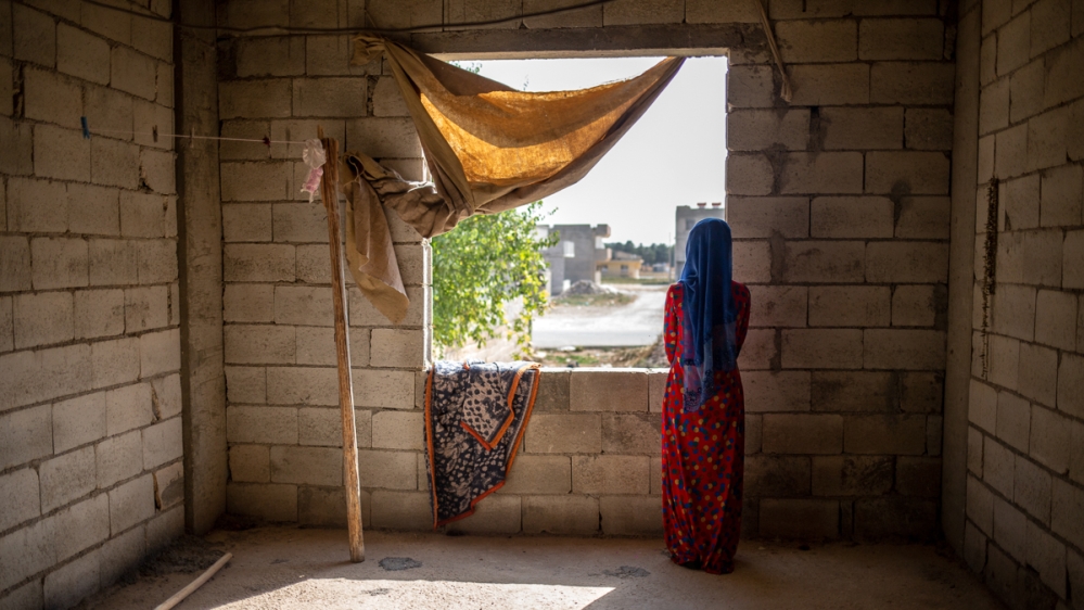 Khalil al-Hassan’s daughter looks out into the direction of Tal Abyad