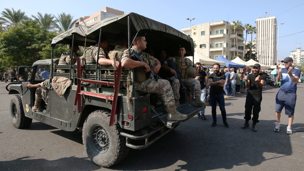 Lebanese army soldiers deploy during a protest targeting the government over an economic crisis in the port city of Sidon