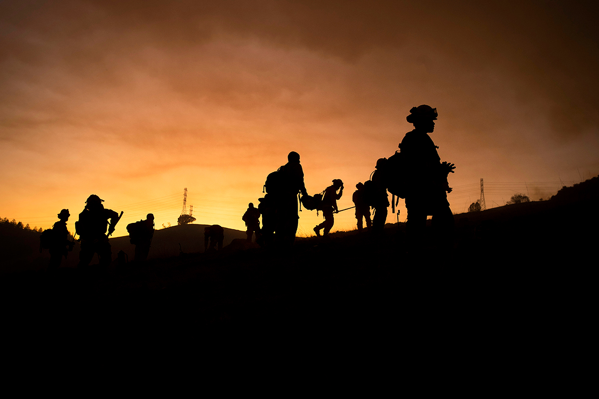 Inmate firefighters battle the Kincade Fire in unincorporated Sonoma County, Calif., near Geyservillle on Saturday, Oct. 26, 2019. About 90,000 residents were ordered to evacuate as extreme winds pred