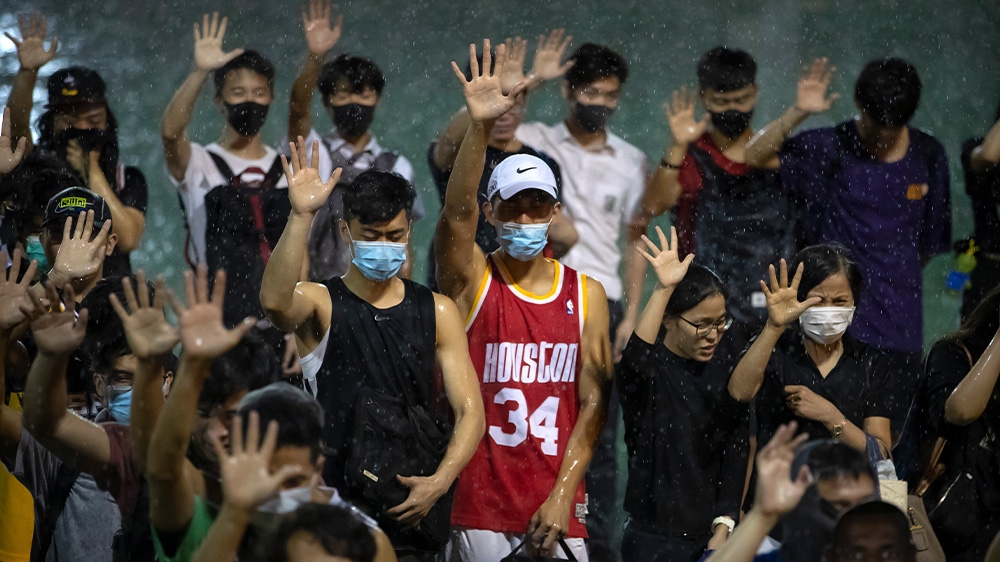 A Hong Kong protester wears a Houston Rockets jersey during a rally earlier this month. The protesters have five demands including the right to elect their ledaer.
