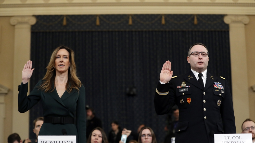 Jennifer Williams, an aide to Vice President Mike Pence, left, and National Security Council aide Lt. Col. Alexander Vindman, are sworn in to testify before the House Intelligence Committee on Capitol