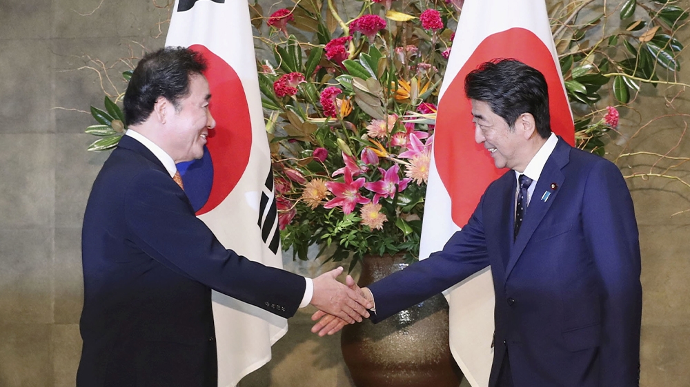 South Korea’s Prime Minister Lee Nak-yon met Japan’s Prime Minister Shinzo Abe at Abe’s official residence in Tokyo last month amid heightened tension between the two allies [Kyodo via Reuters]