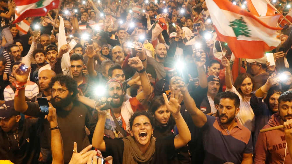 Demonstrators shout during a protest in Tripoli