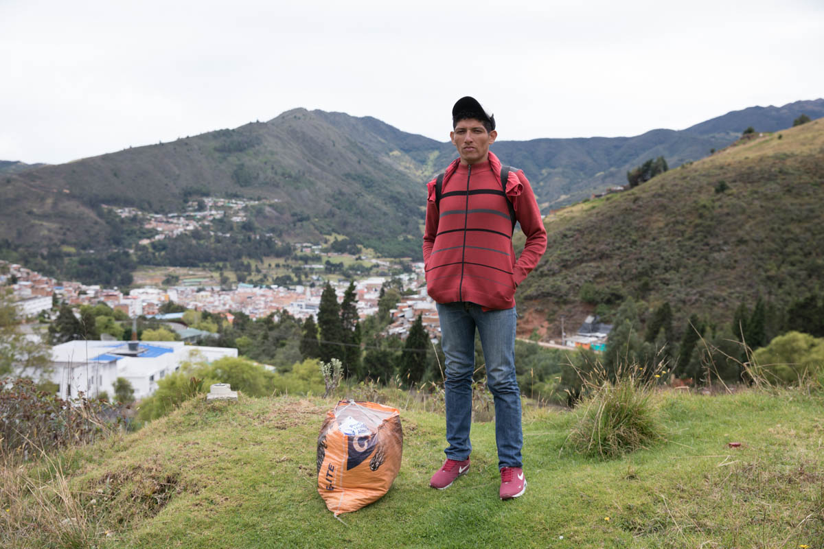 Rigoberto pauses on the side of the road on the outskirts of Pamplona, Colombia. He has been walking for three days toward San Gil where he hopes to find work on a coffee plantation. “I used to wor