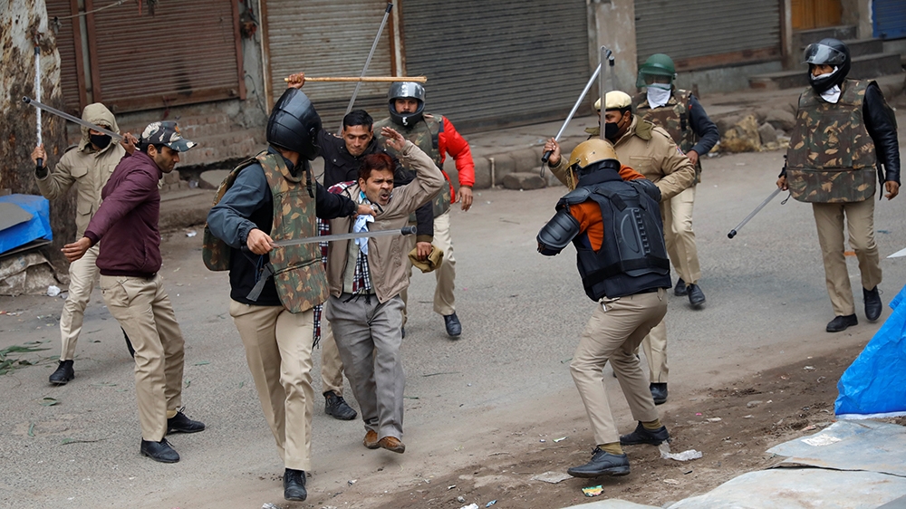 Police officers detain a demonstrator during a protest against a new citizenship law in Seelampur, area of Delhi, India December 17, 2019. REUTERS/Danish Siddiqui
