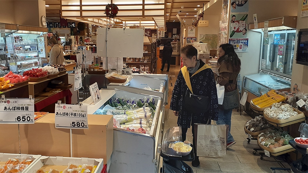 Customers browse in a Tokyo shop that specialises in products from Fukushima