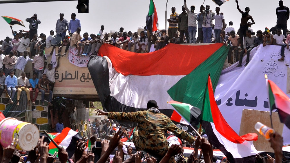 Sudanese soldier outside army HQ 