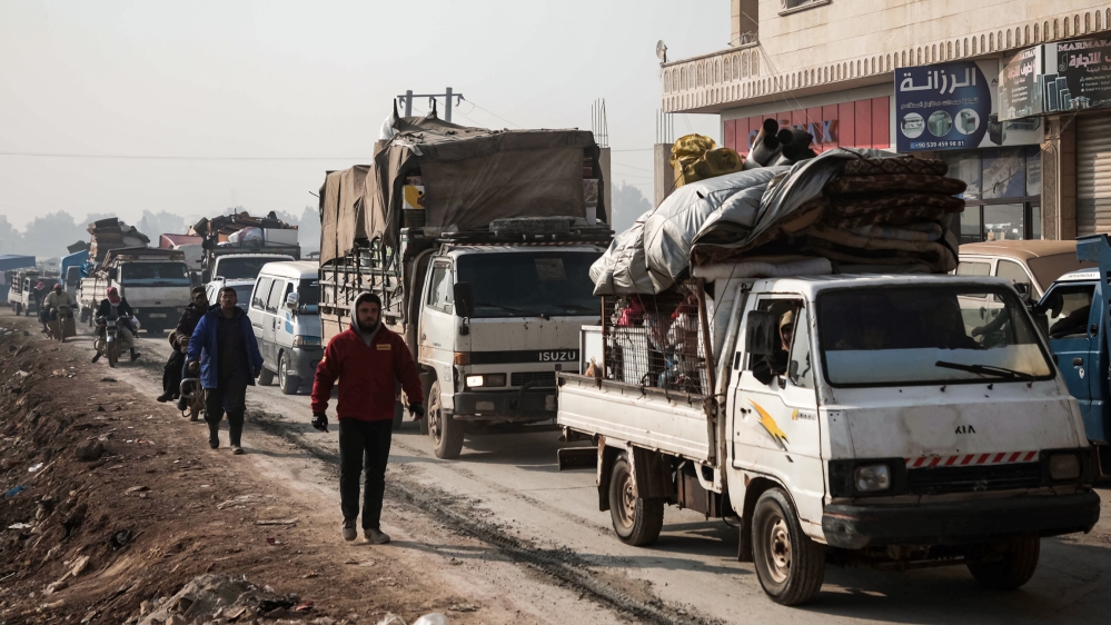 This picture taken on December 22, 2019 shows a column of traffic composed of the vehicles of people from the south of Idlib province fleeing bombardment by the government and its allies on the northw