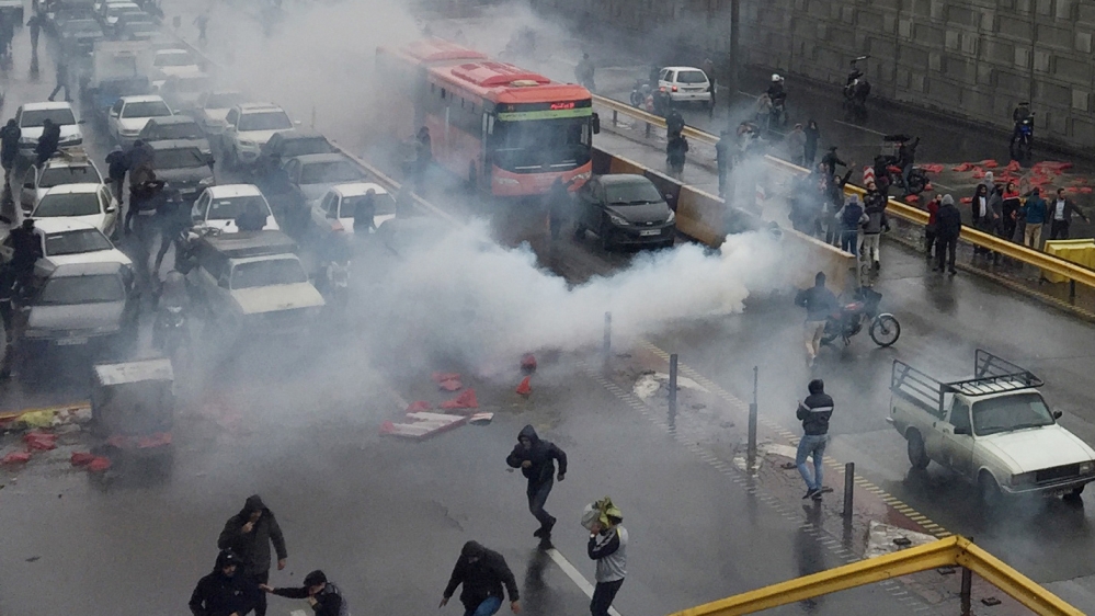 Riot police tries to disperse people as they protest on a highway against increased gas price in Tehran, Iran November 16, 2019. Nazanin Tabatabaee/WANA (West Asia News Agency) via REUTERS ATTENTION E