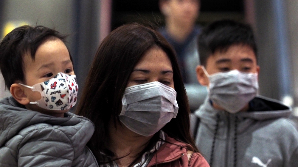 People wear face masks at a Taipei Metro station as the island confirmed its first case of the new coronavirus that emerged in Wuhan in December