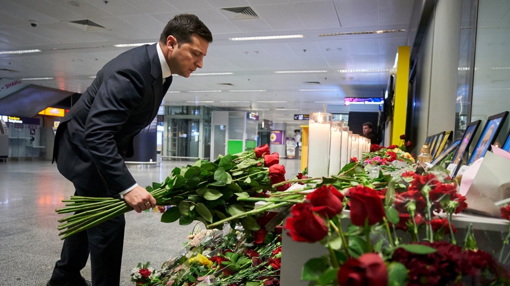 Ukrainian President Volodymyr Zelenskiy lays flowers