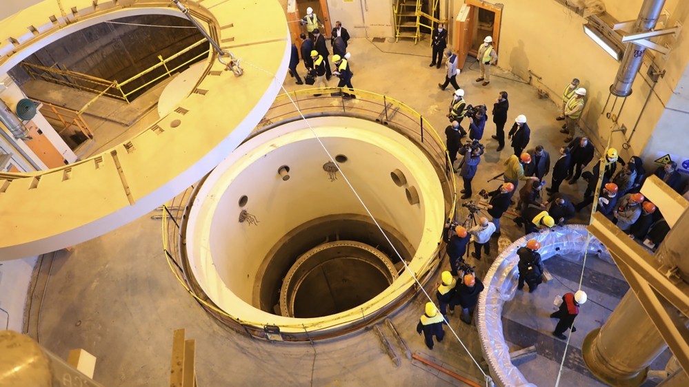In this photo released by the Atomic Energy Organization of Iran, technicians work at the Arak heavy water reactor''s secondary circuit, as officials and media visit the site, near Arak, 150 miles (250