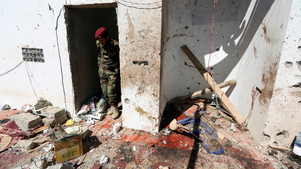 A soldier stands at the site of a Houthi missile attack on a military camp’s mosque in Marib