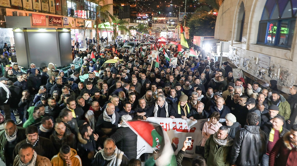 Palestinians take part in a demonstration in the West Bank city of Nablus on January 28, 2020, to protest against US President Donald Trump''s peace plan proposal. - Palestinians staged protests agains