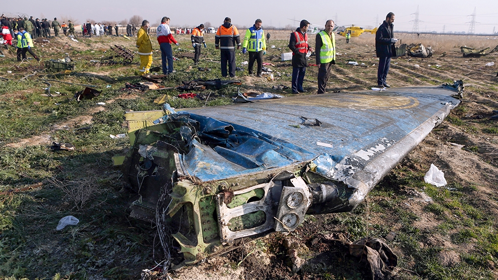 Rescue teams are seen on January 8, 2020 at the scene of a Ukrainian airliner that crashed shortly after take-off near Imam Khomeini airport in the Iranian capital Tehran. - Search-and-rescue teams we