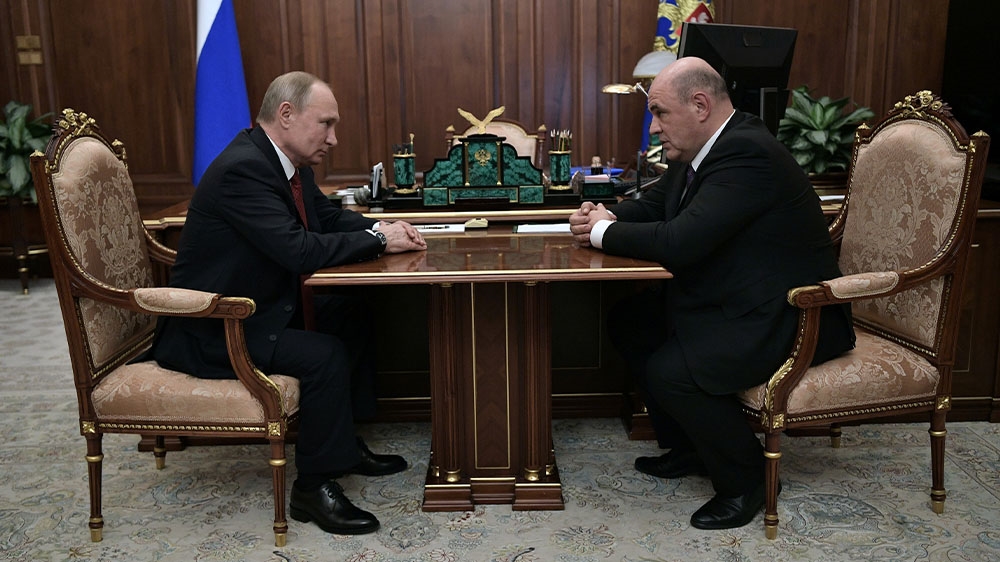 Putin has nominated the head of the Federal Taxation Service Mikhail Mishustin, right, as Russia’s next prime minister