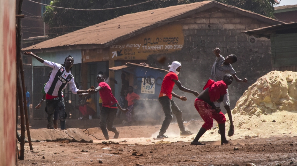 The President of Guinea Alpha Conde (C), arrives at the African Union headquarters in Addis Ababa during the 33rd Ordinary Session of the Assembly of the African heads of States which is being held in
